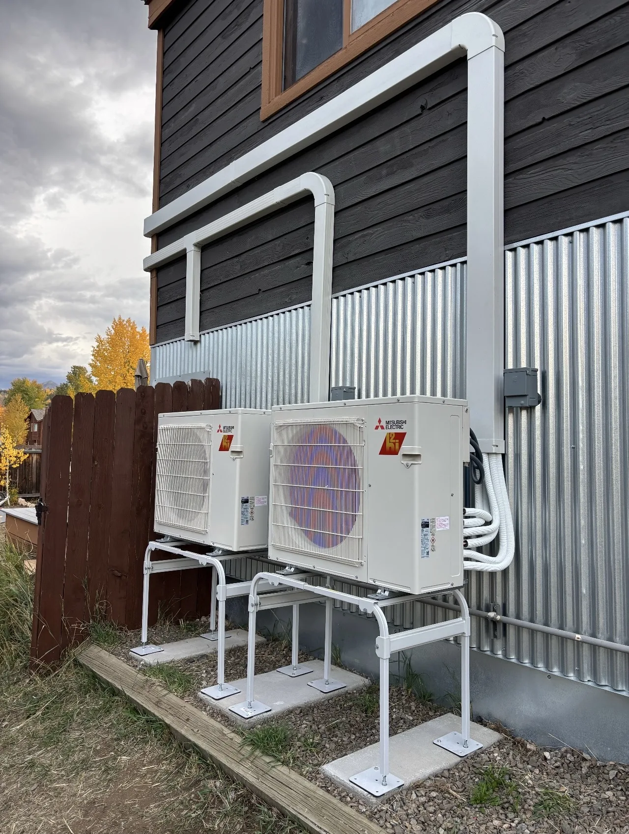 Two Mitsubishi Electric heat pumps on stands